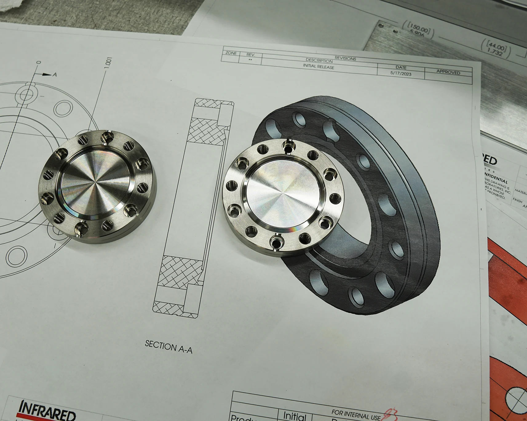 Precision machined components shown with an engineering drawing Precision machined components shown with an engineering drawing